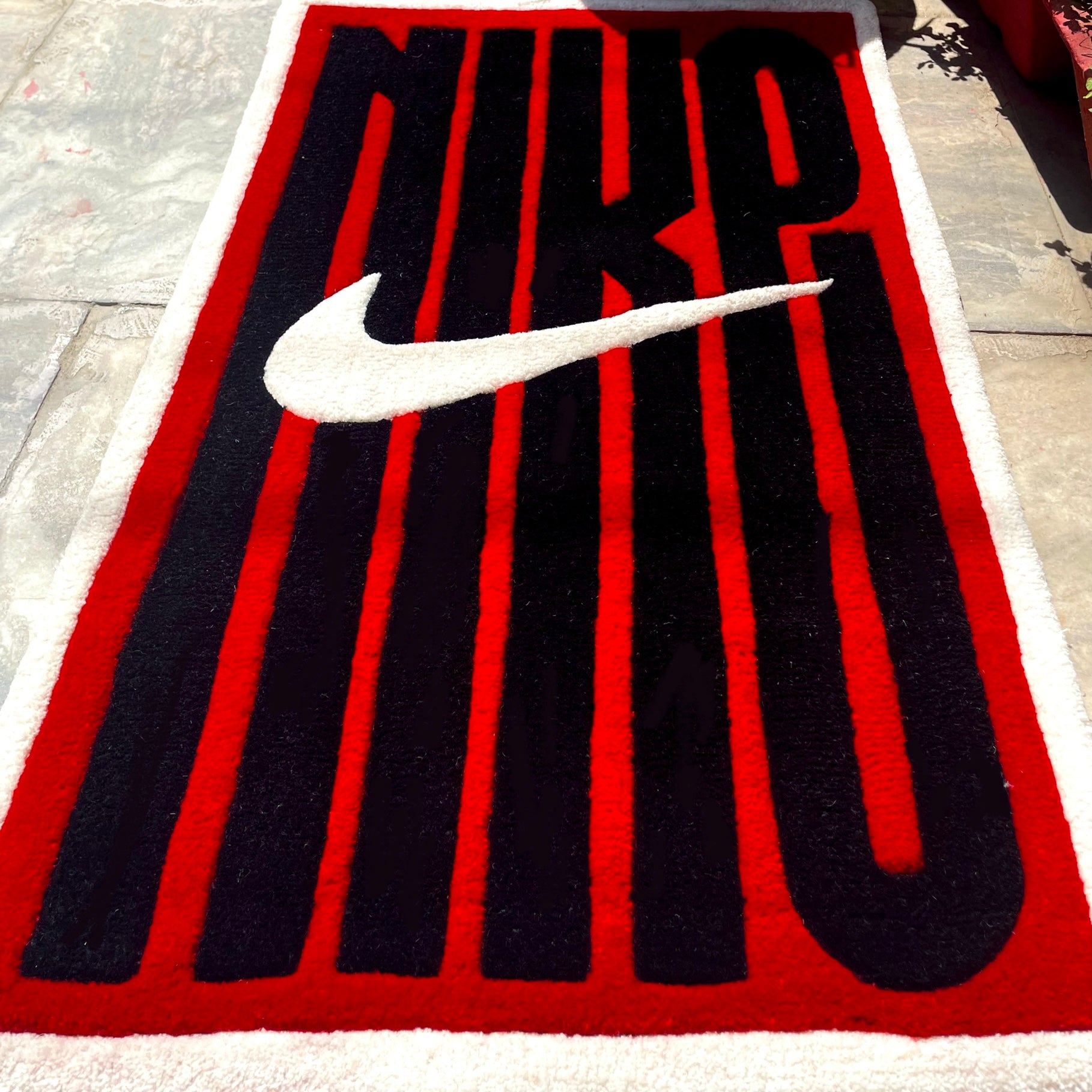 Nike Linear Typography Hand-Tufted Rug low angle view