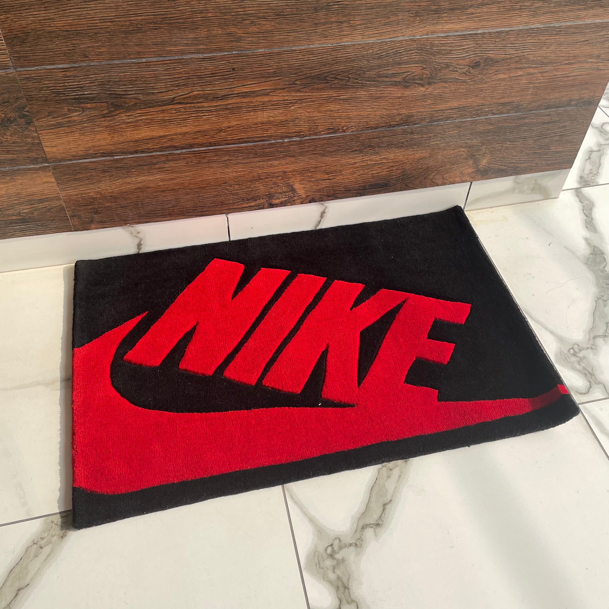 Nike Red and Black Hand-Tufted Rug low angle view