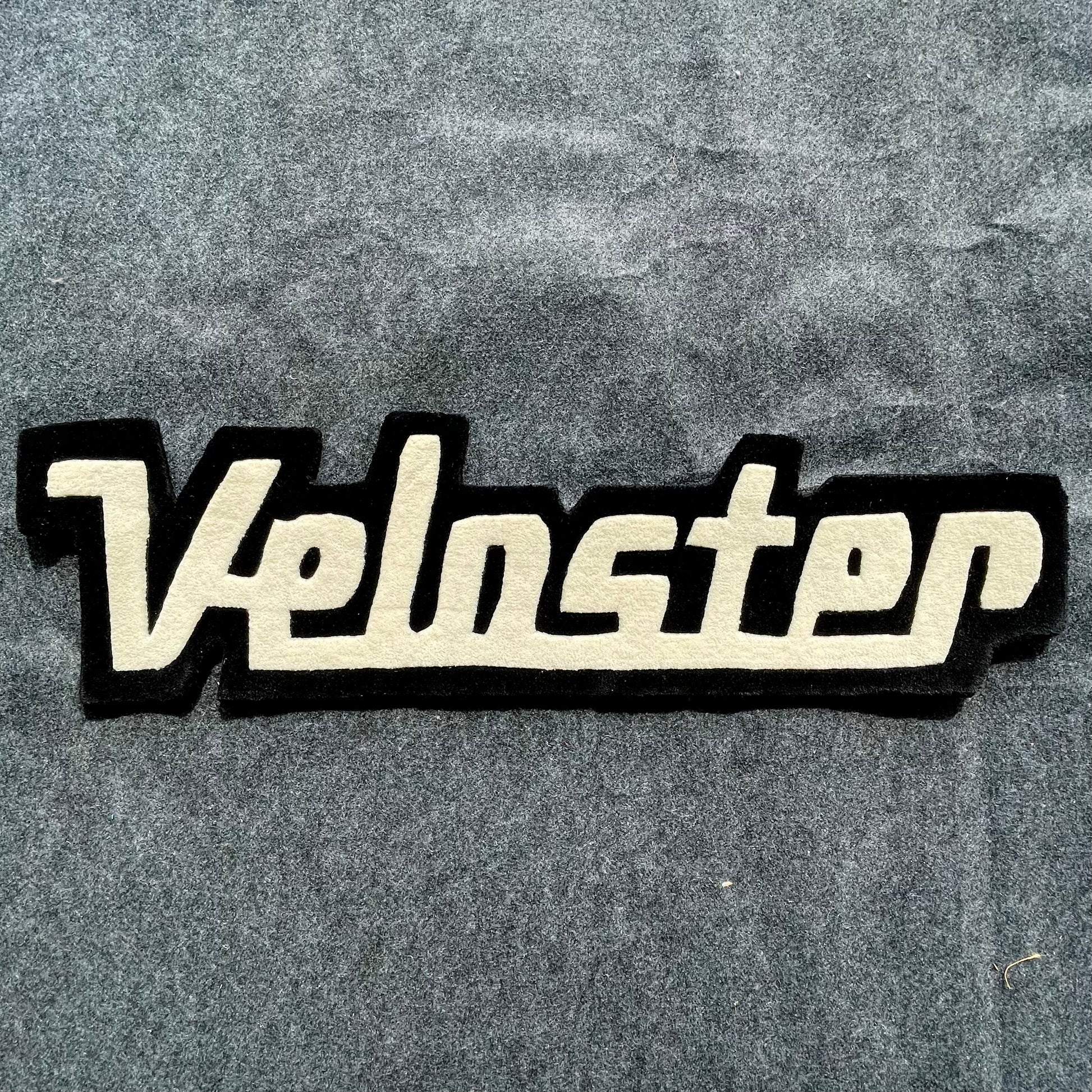 Veloster Typography Hand-Tufted Rug