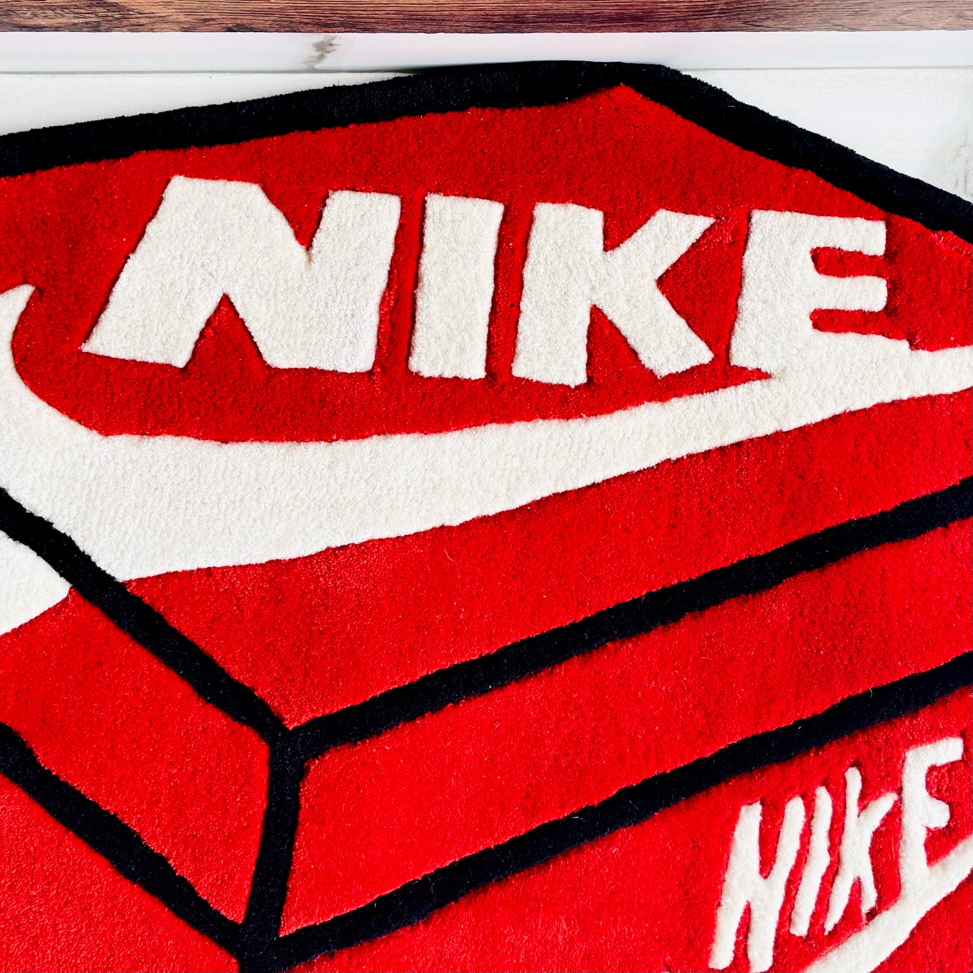 Nike 3D Look Shoe Box Shape Hand-Tufted Rug closeup