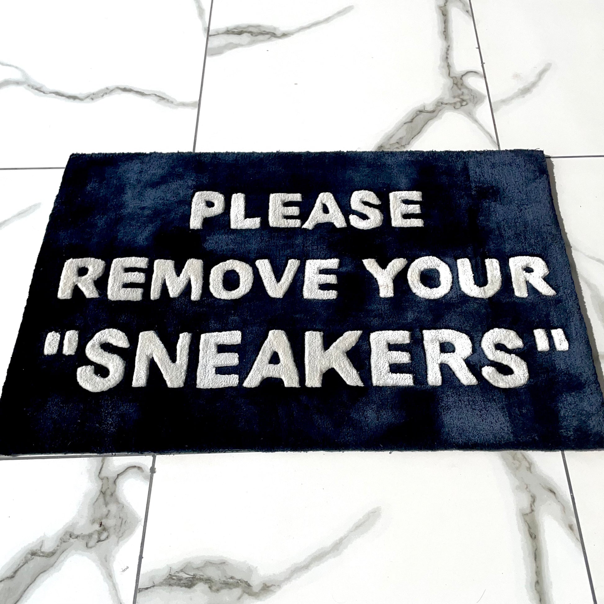 Please Remove Your SNEAKERS Hand-Tufted Rug low angle view