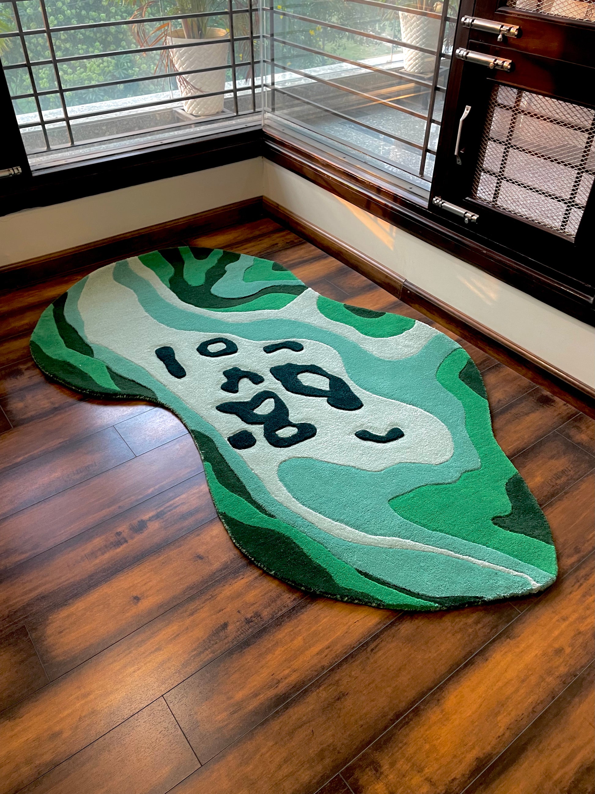 Lush Green Living Area Abstract Rug side view