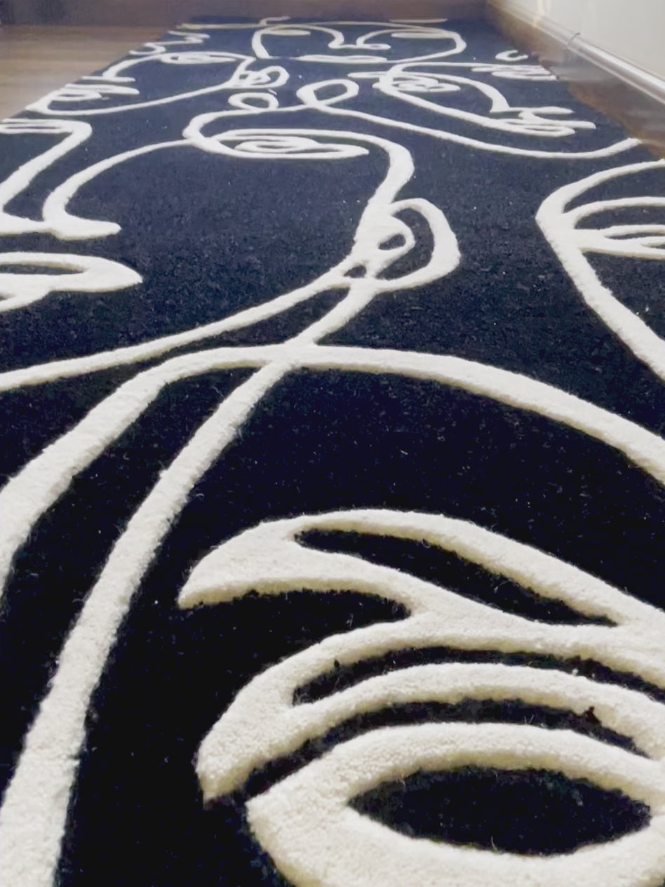 close up video of Abstract Faces Hand-Tufted Rug